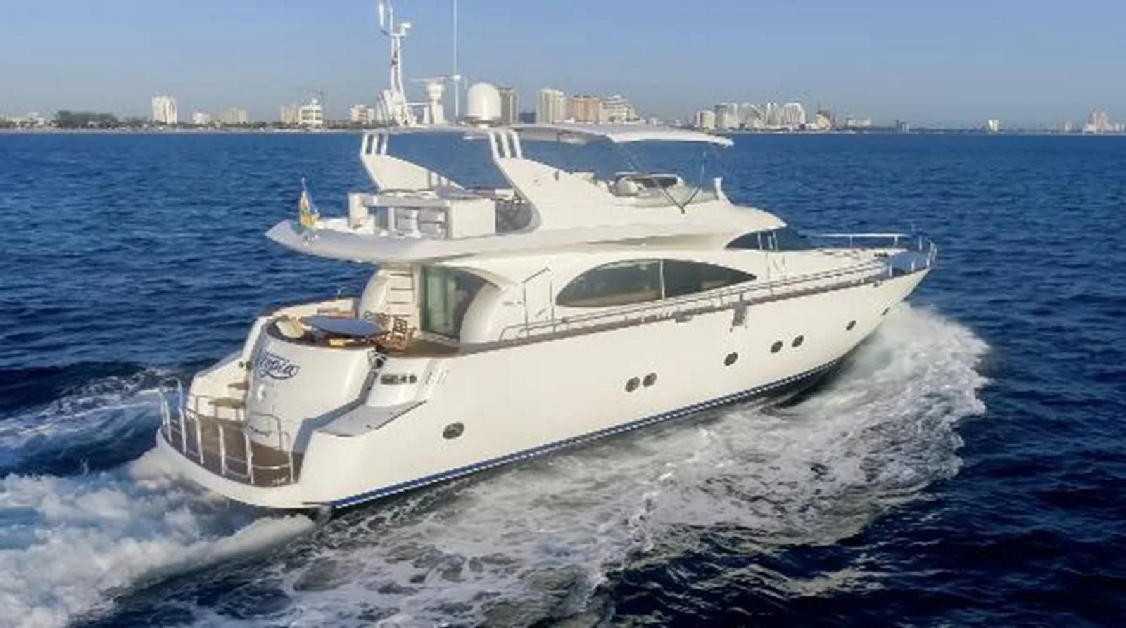 a white yacht on the water aboard UTOPIA Yacht for Sale