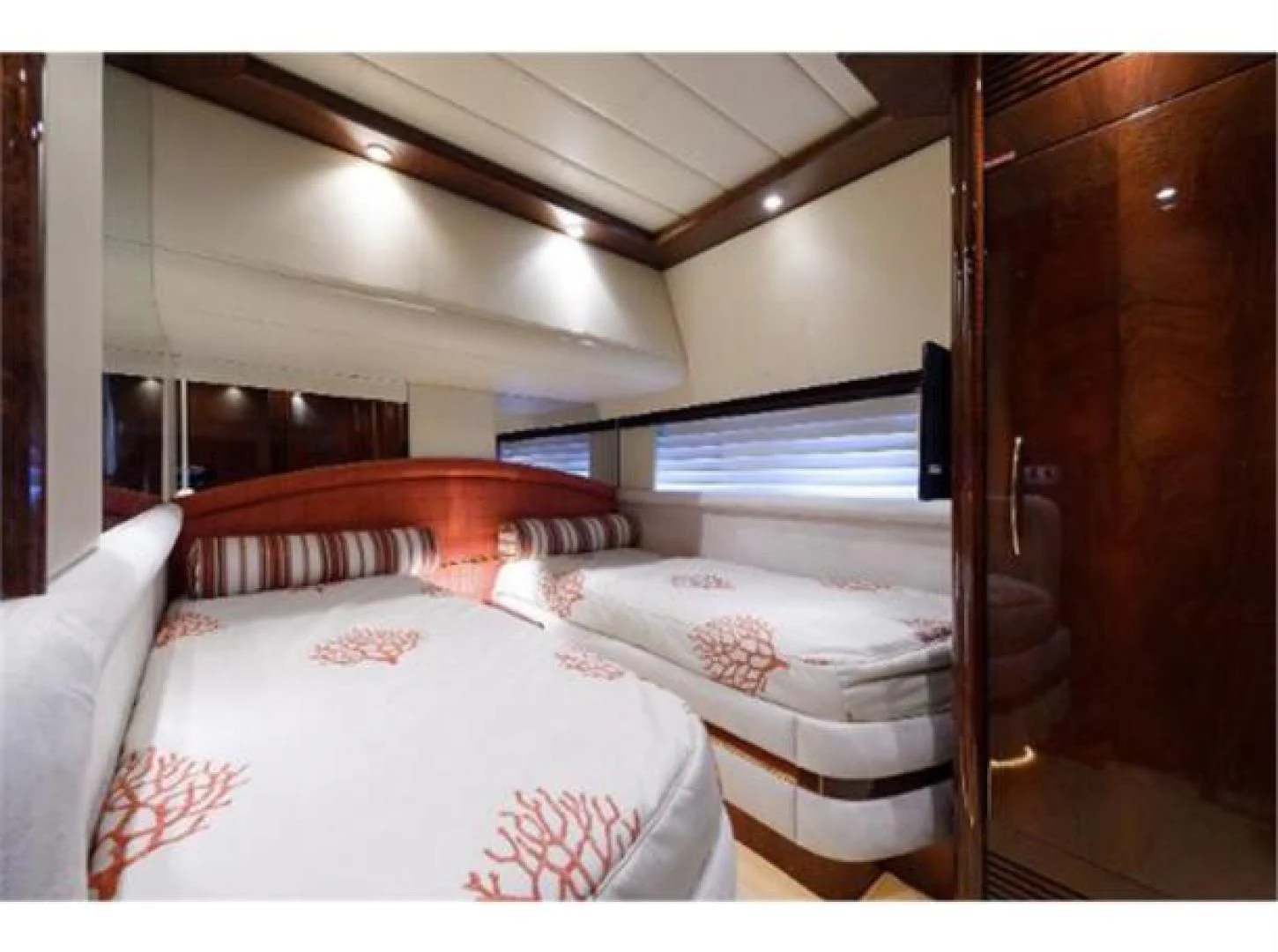 a couple of beds in a room aboard UTOPIA Yacht for Sale
