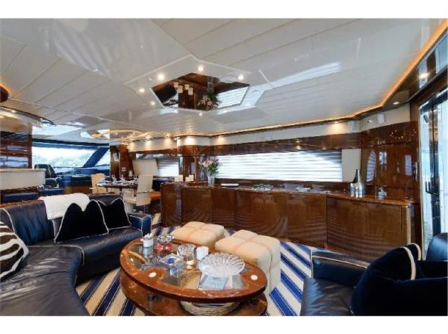 a living room with leather couches aboard UTOPIA Yacht for Sale