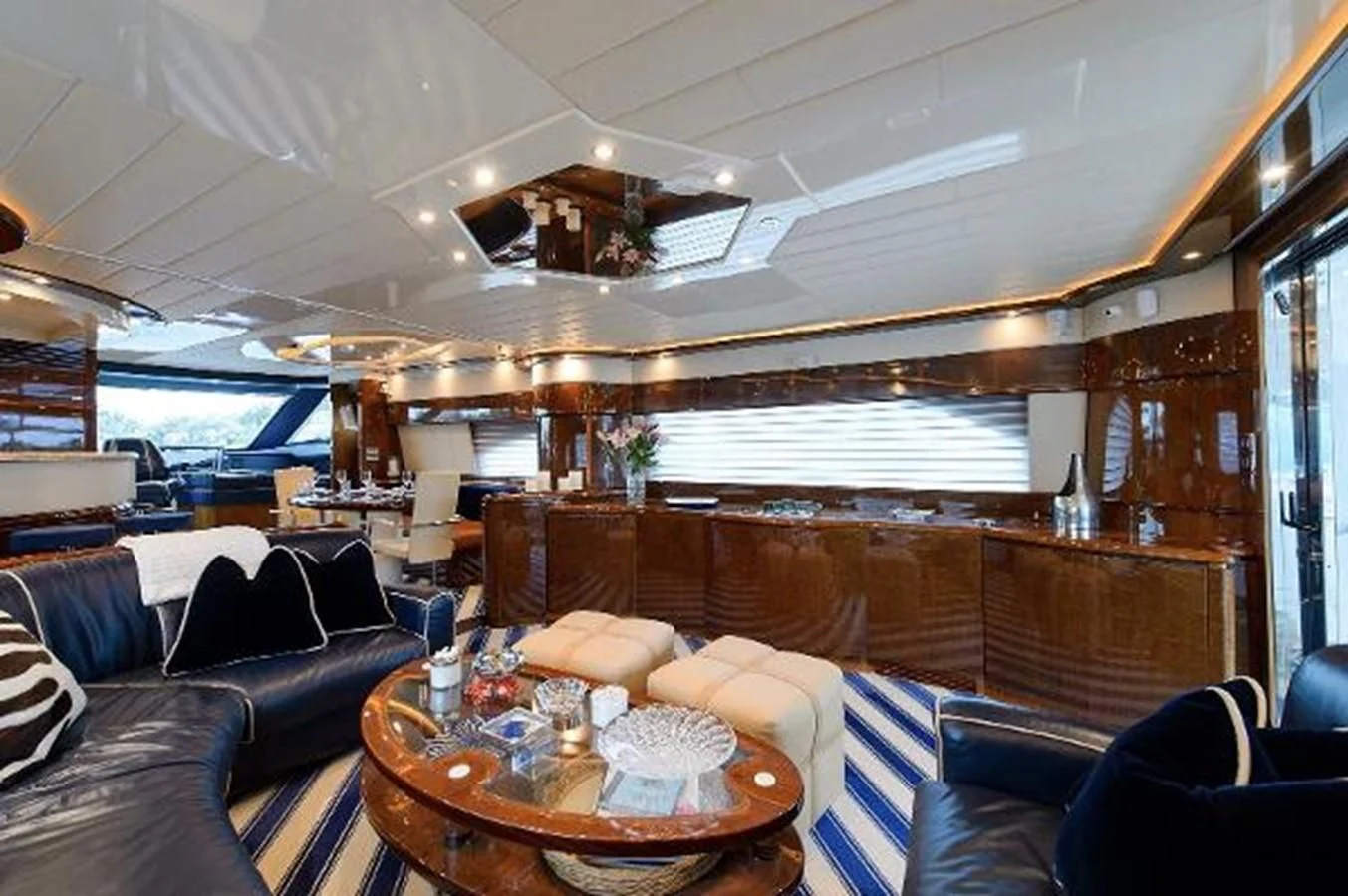 a boat with a table and chairs aboard UTOPIA Yacht for Sale
