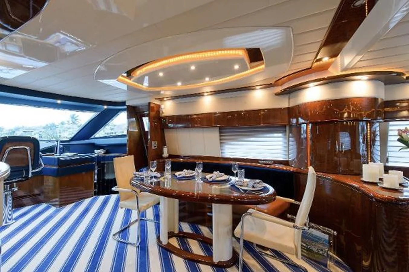 a boat with a table and chairs aboard UTOPIA Yacht for Sale