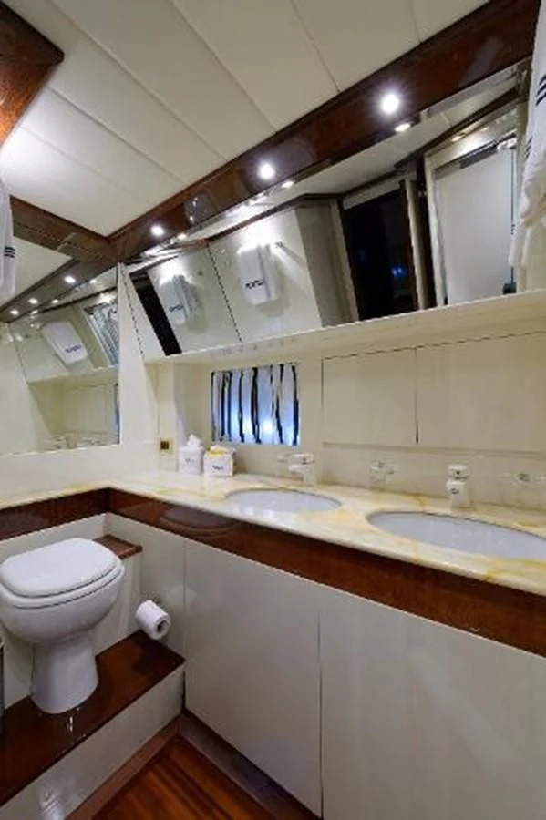 a bathroom with a sink and toilet aboard UTOPIA Yacht for Sale