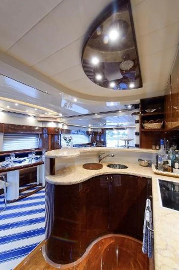 a kitchen with a sink and a stove aboard UTOPIA Yacht for Sale