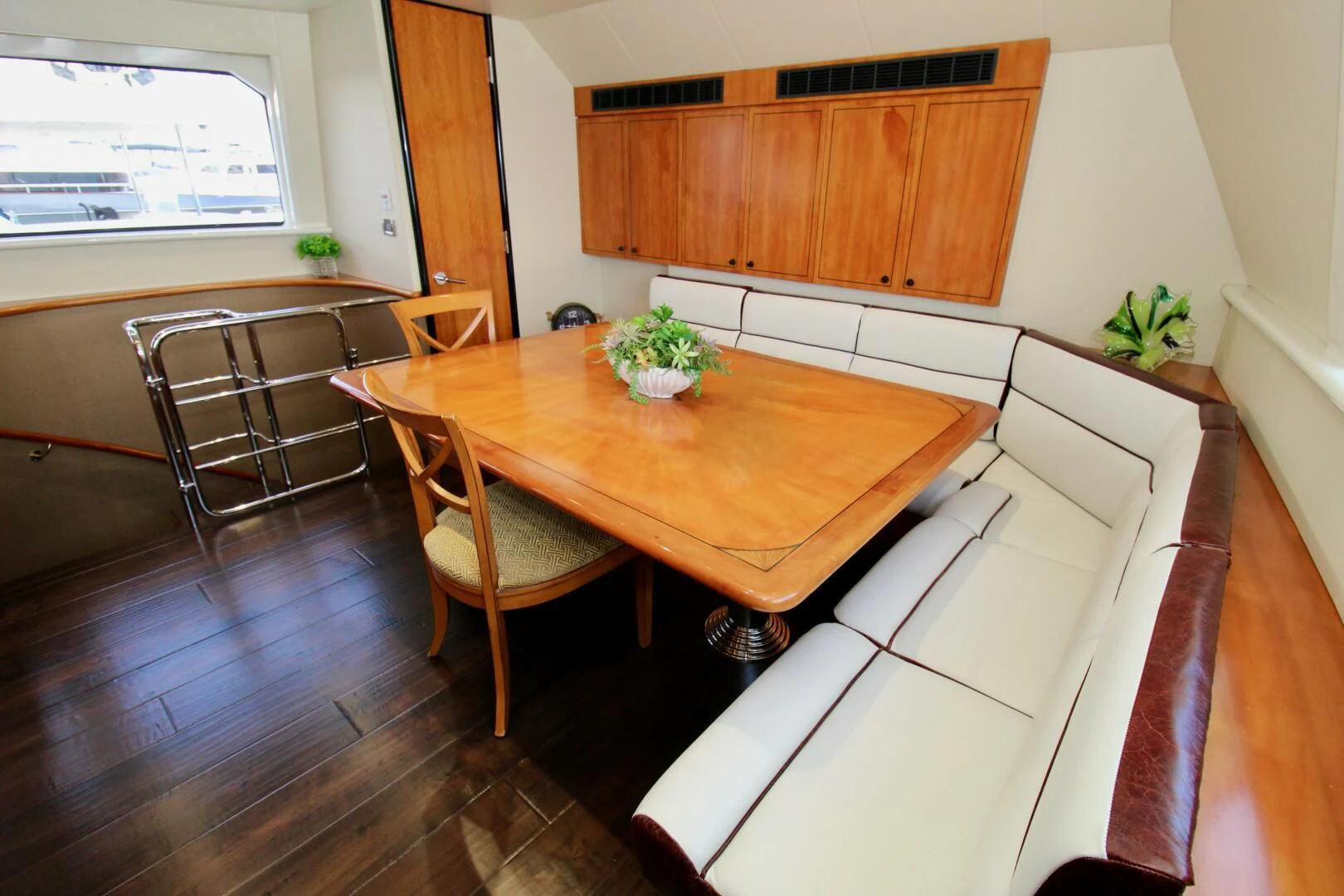a kitchen with a table and chairs aboard MY WAY Yacht for Sale