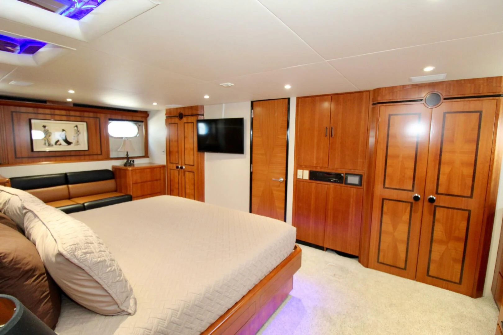 a bedroom with a bed and cabinets aboard MY WAY Yacht for Sale