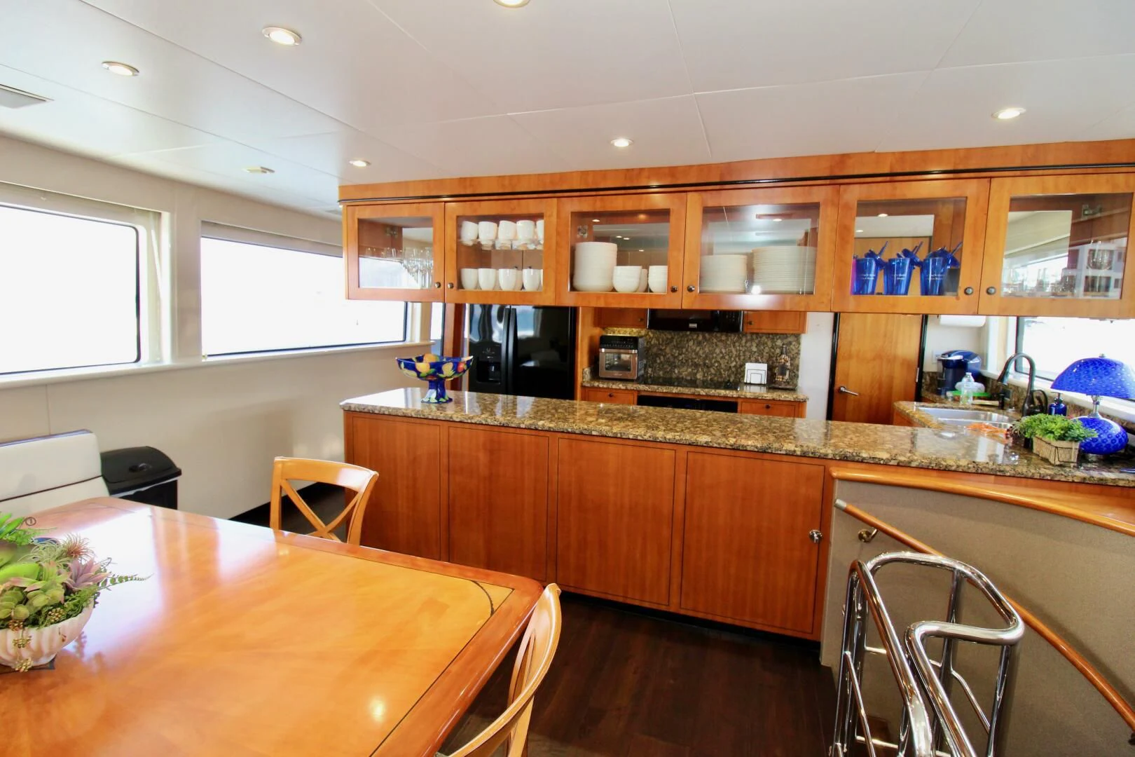 a kitchen with wooden cabinets aboard MY WAY Yacht for Sale