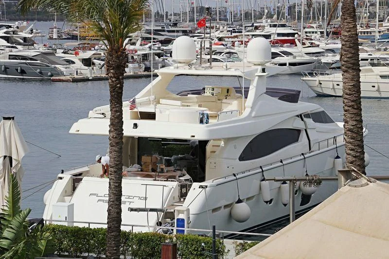 a boat docked at a pier aboard FLOATING ASSET Yacht for Sale