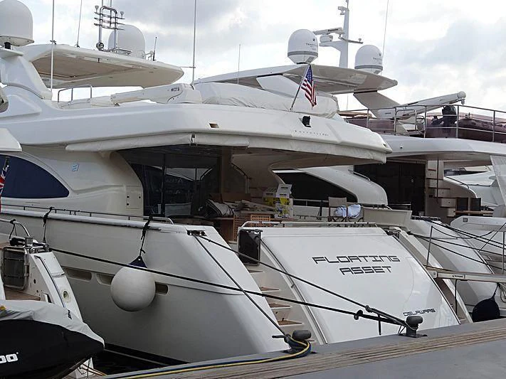 a couple of boats are parked aboard FLOATING ASSET Yacht for Sale