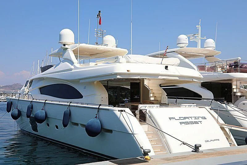 a couple of boats sit next to each other aboard FLOATING ASSET Yacht for Sale