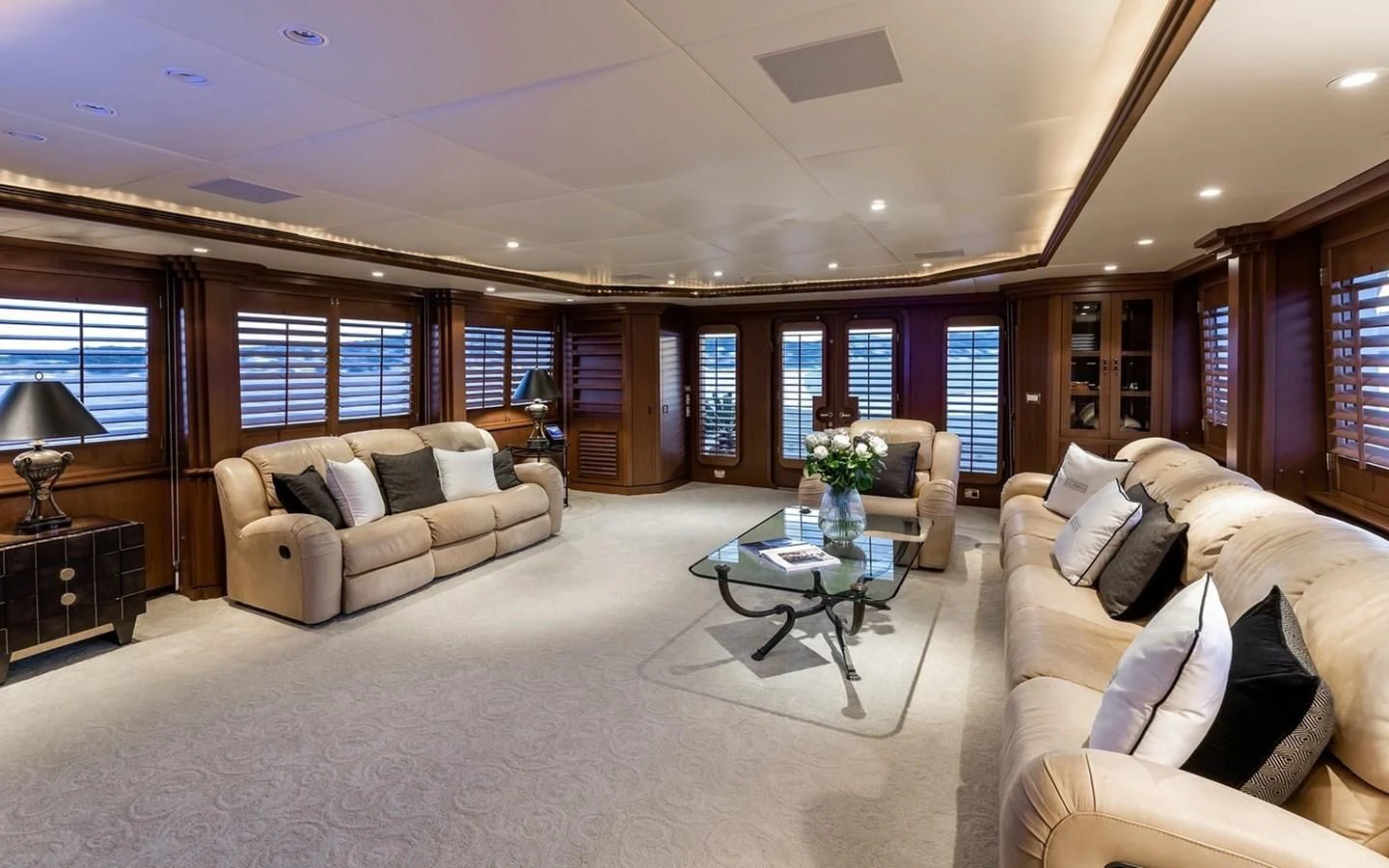 a living room with a couch and a coffee table aboard SIERRA 2 Yacht for Sale