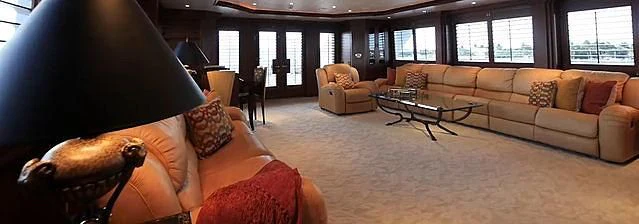 a living room with a couch and a coffee table aboard SIERRA 2 Yacht for Sale