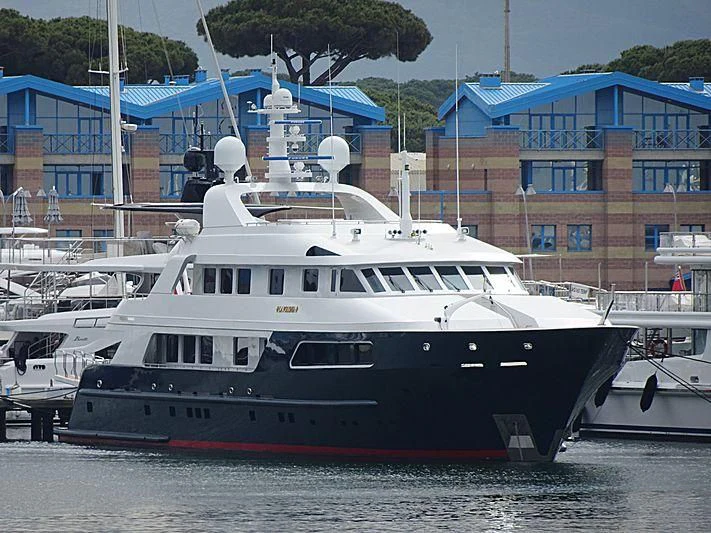 a large white boat sits in the water aboard SIERRA 2 Yacht for Sale