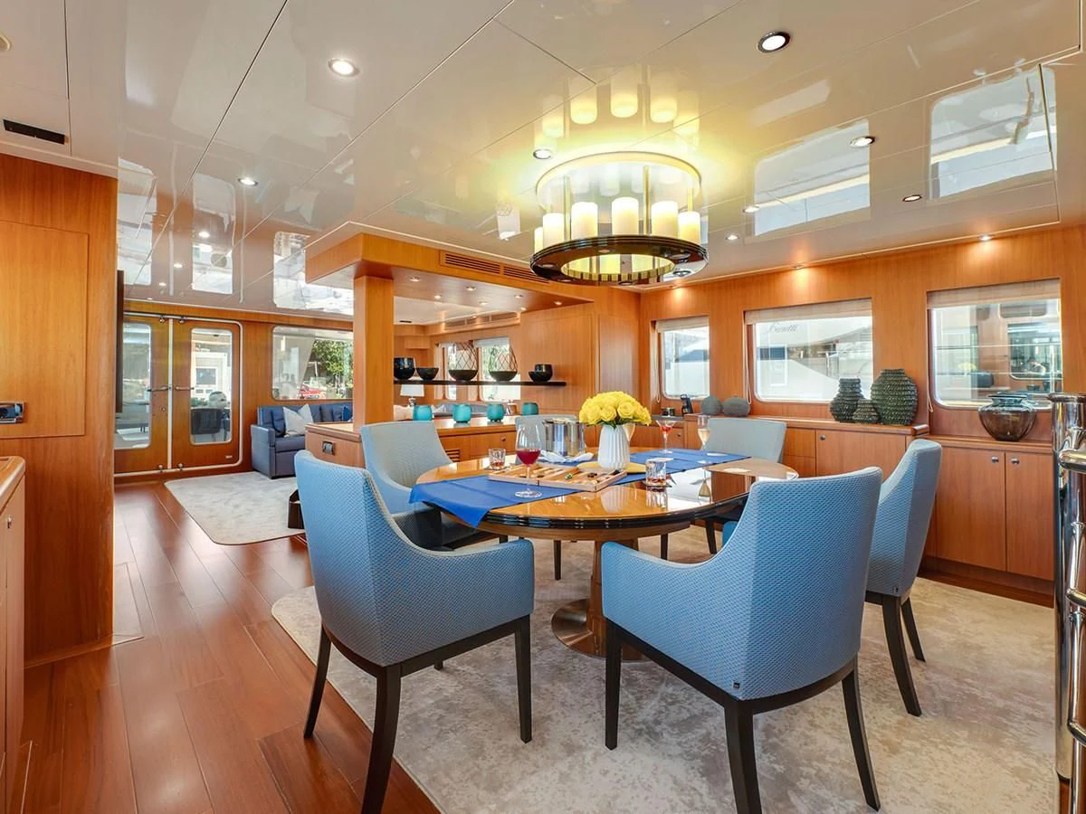 a large kitchen with a dining table aboard MOCEAN Yacht for Sale