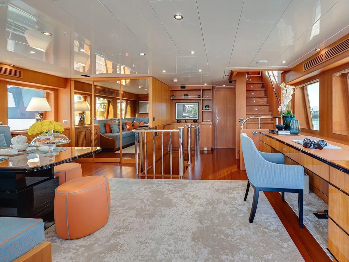 a large living room with a kitchen and dining area aboard MOCEAN Yacht for Sale