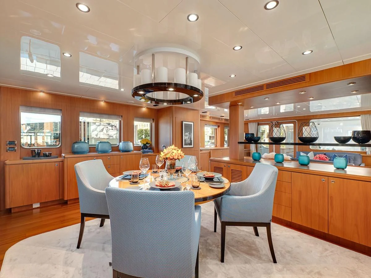 a kitchen with a dining table aboard MOCEAN Yacht for Sale
