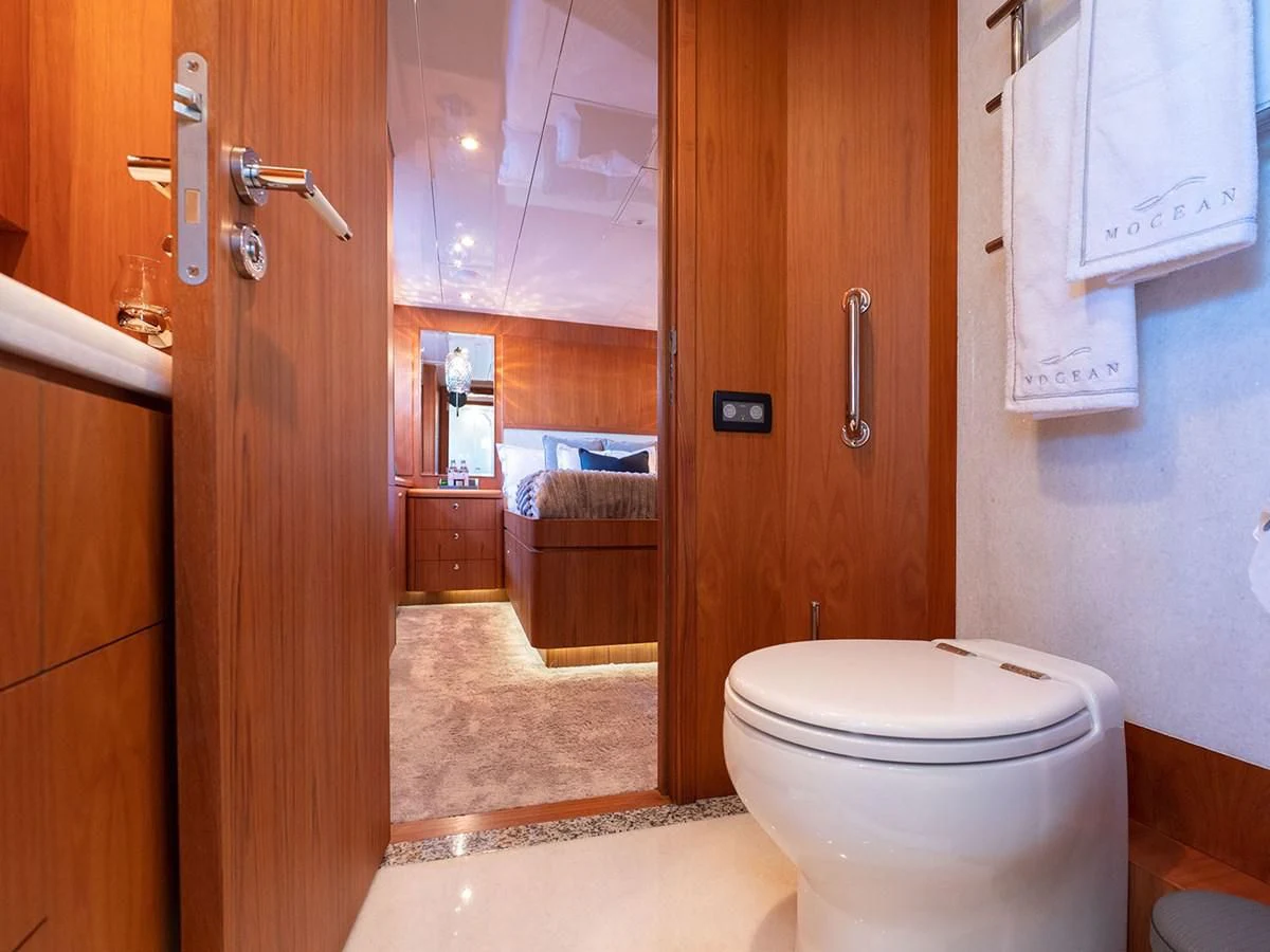 a bathroom with a toilet and a sink aboard MOCEAN Yacht for Sale