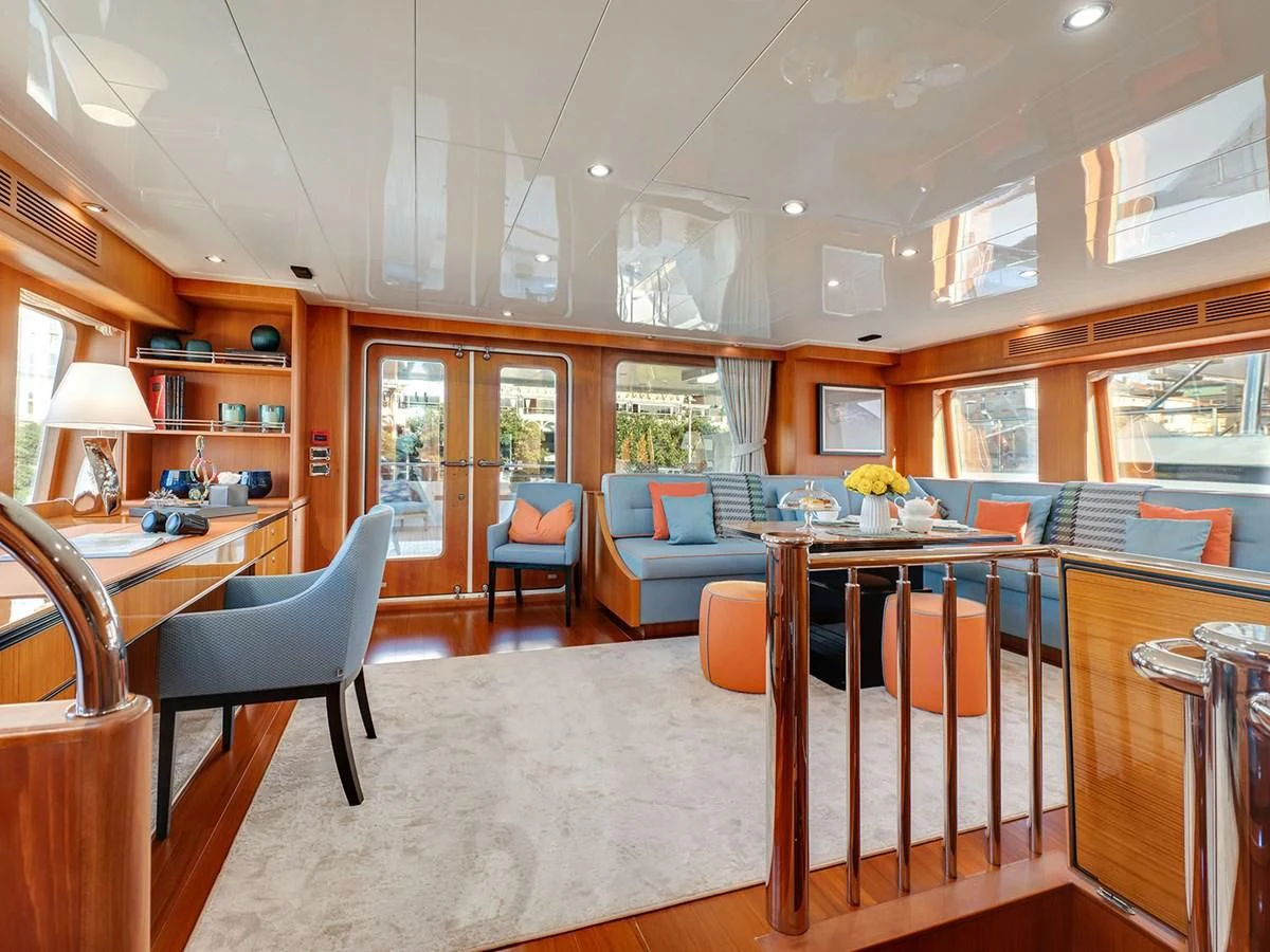a large room with a table and chairs aboard MOCEAN Yacht for Sale