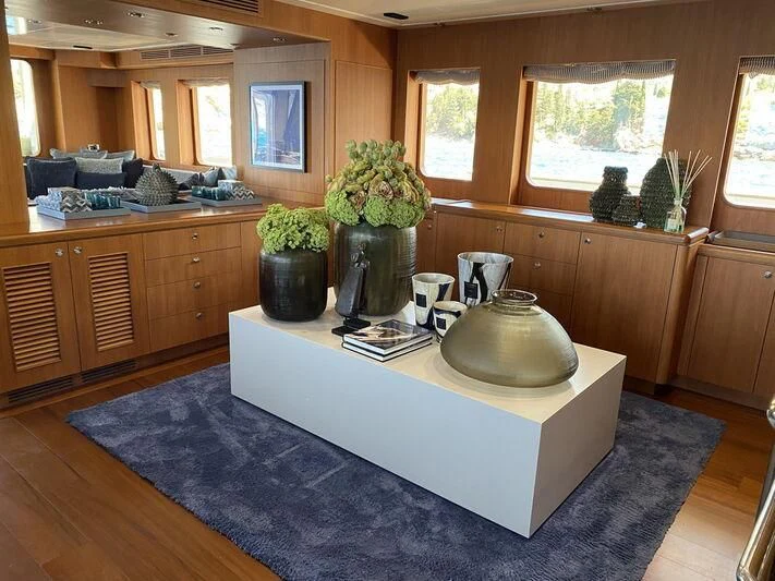 a kitchen with a large round table aboard MOCEAN Yacht for Sale
