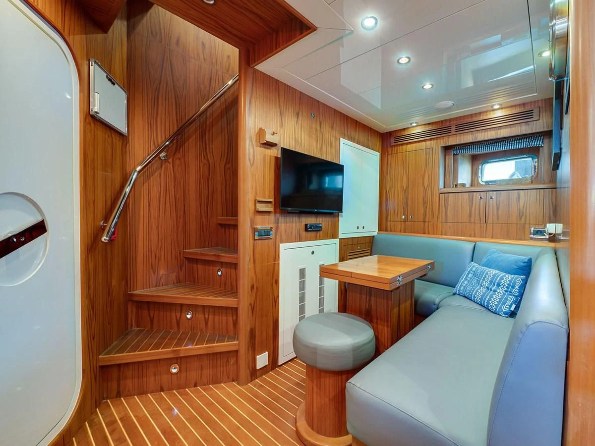 a room with a bed and a desk aboard MOCEAN Yacht for Sale