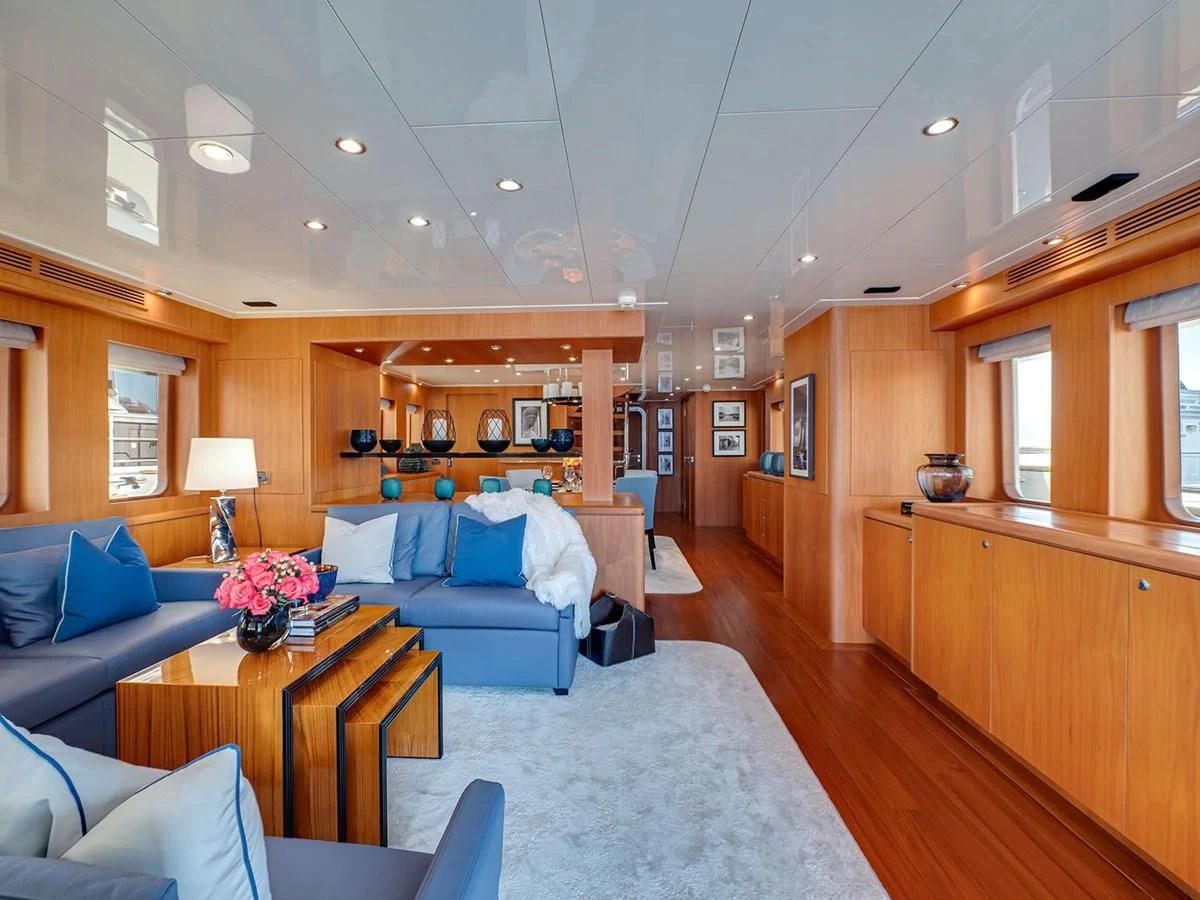 a large living room with a wood floor aboard MOCEAN Yacht for Sale