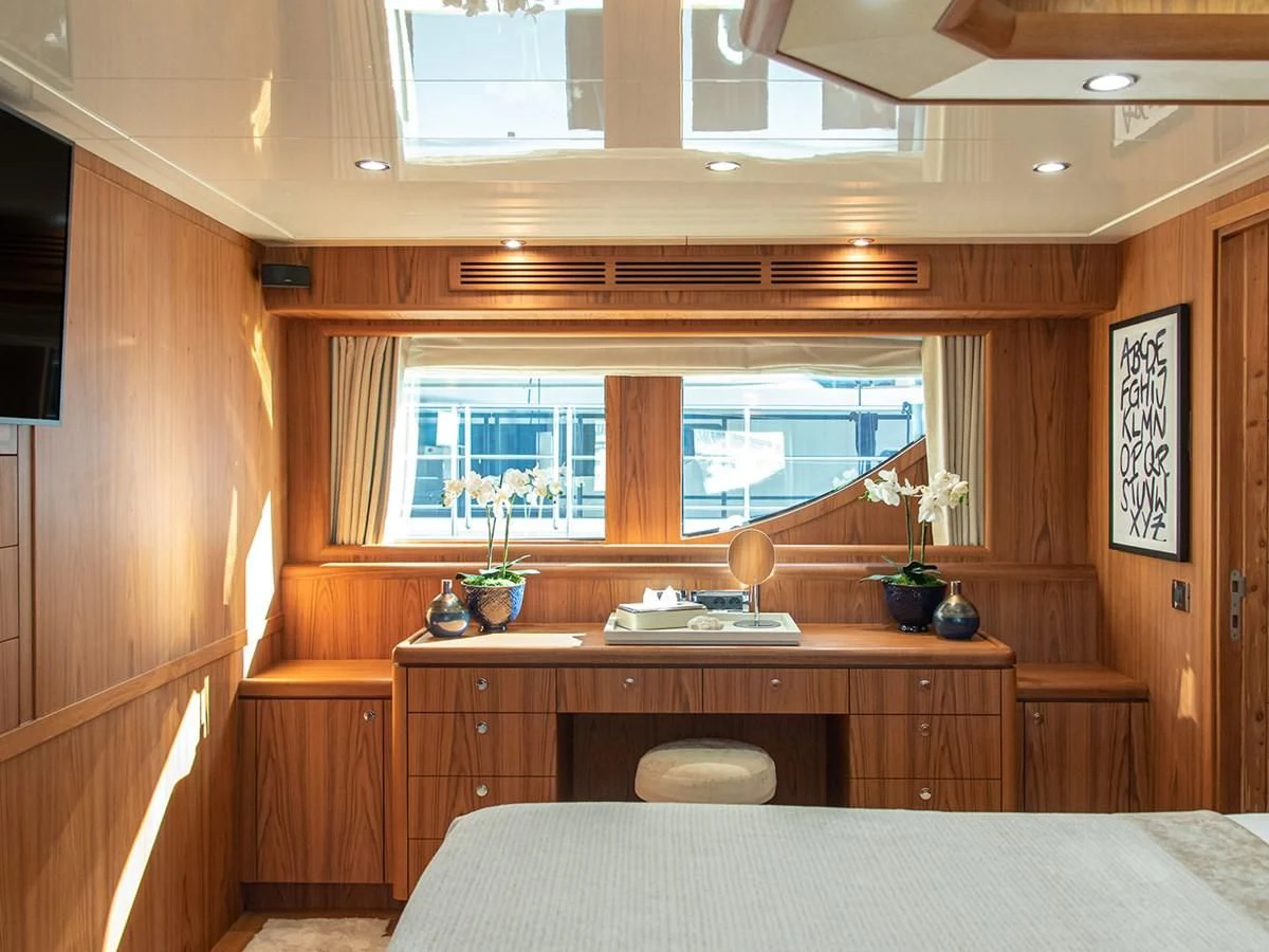 a room with a table and chairs aboard MOCEAN Yacht for Sale