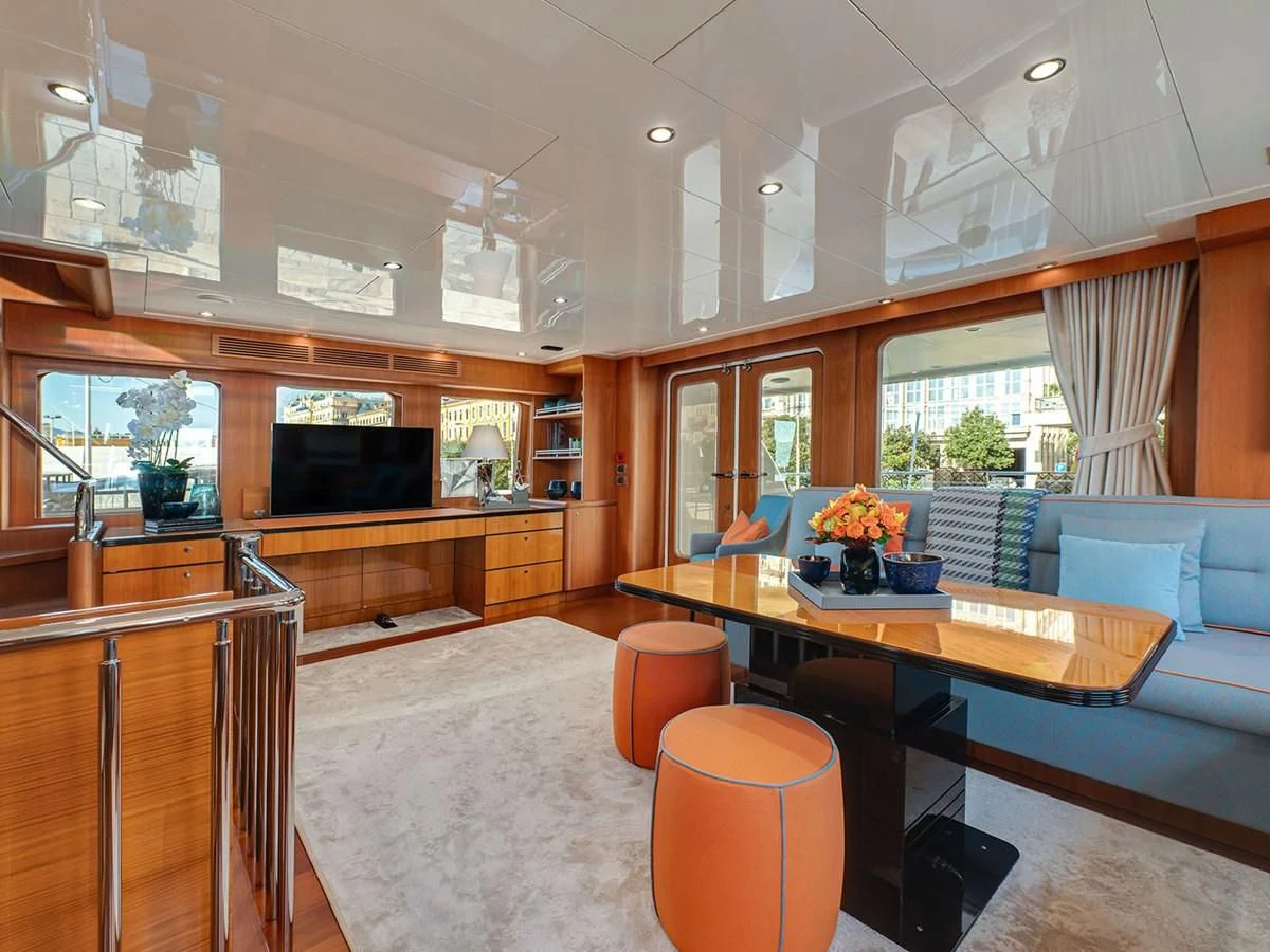a living room with a table and chairs aboard MOCEAN Yacht for Sale