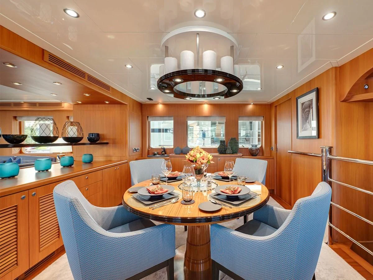a kitchen with a dining table aboard MOCEAN Yacht for Sale