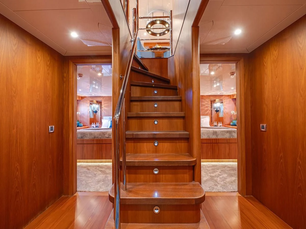 a wooden staircase in a house aboard MOCEAN Yacht for Sale