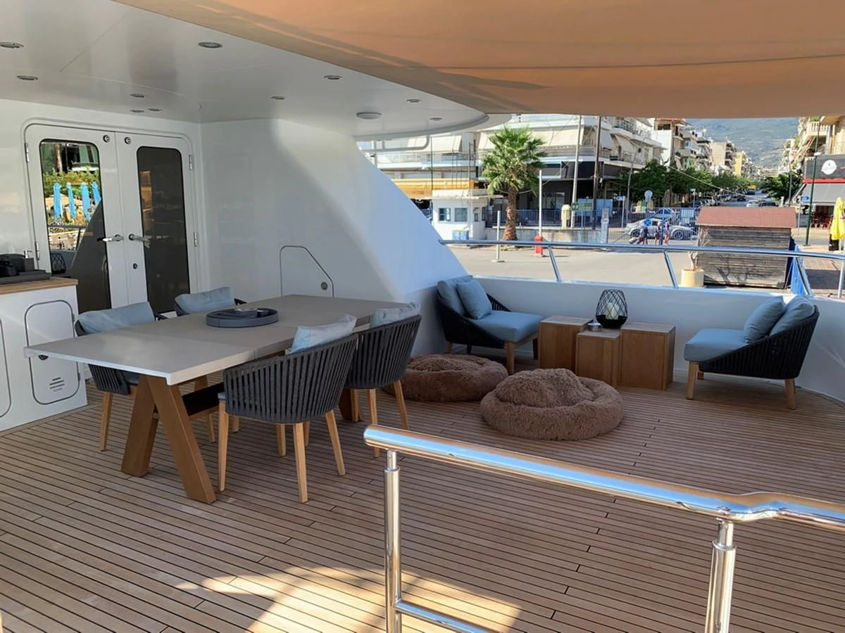 a room with a table and chairs aboard MOCEAN Yacht for Sale