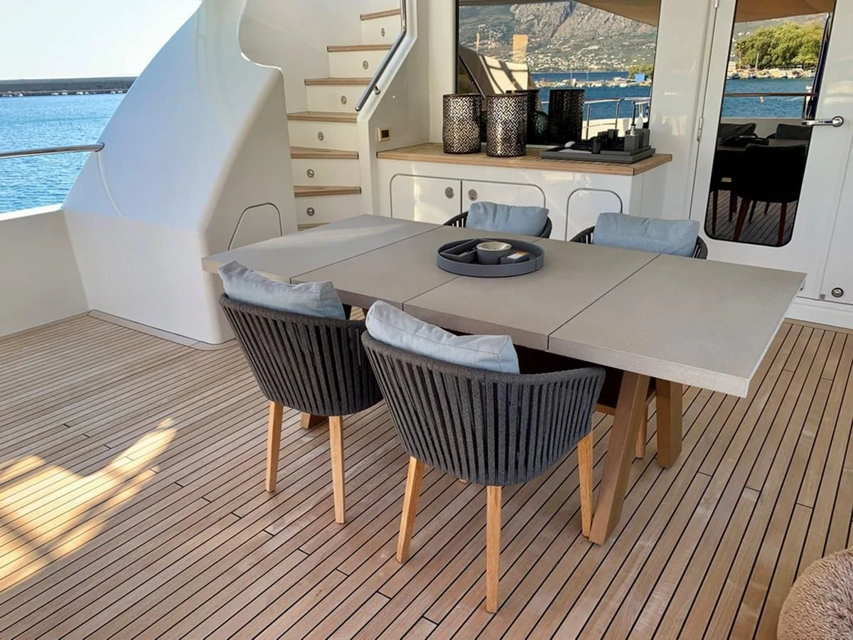 a kitchen with a table and chairs aboard MOCEAN Yacht for Sale