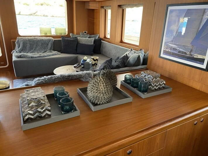 a living room with a large window aboard MOCEAN Yacht for Sale