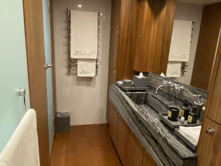 a bathroom with a countertop sink and mirror aboard MOCEAN Yacht for Sale