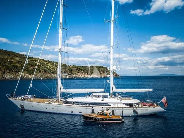 a boat with a sail on the water aboard ROSEHEARTY Yacht for Charter