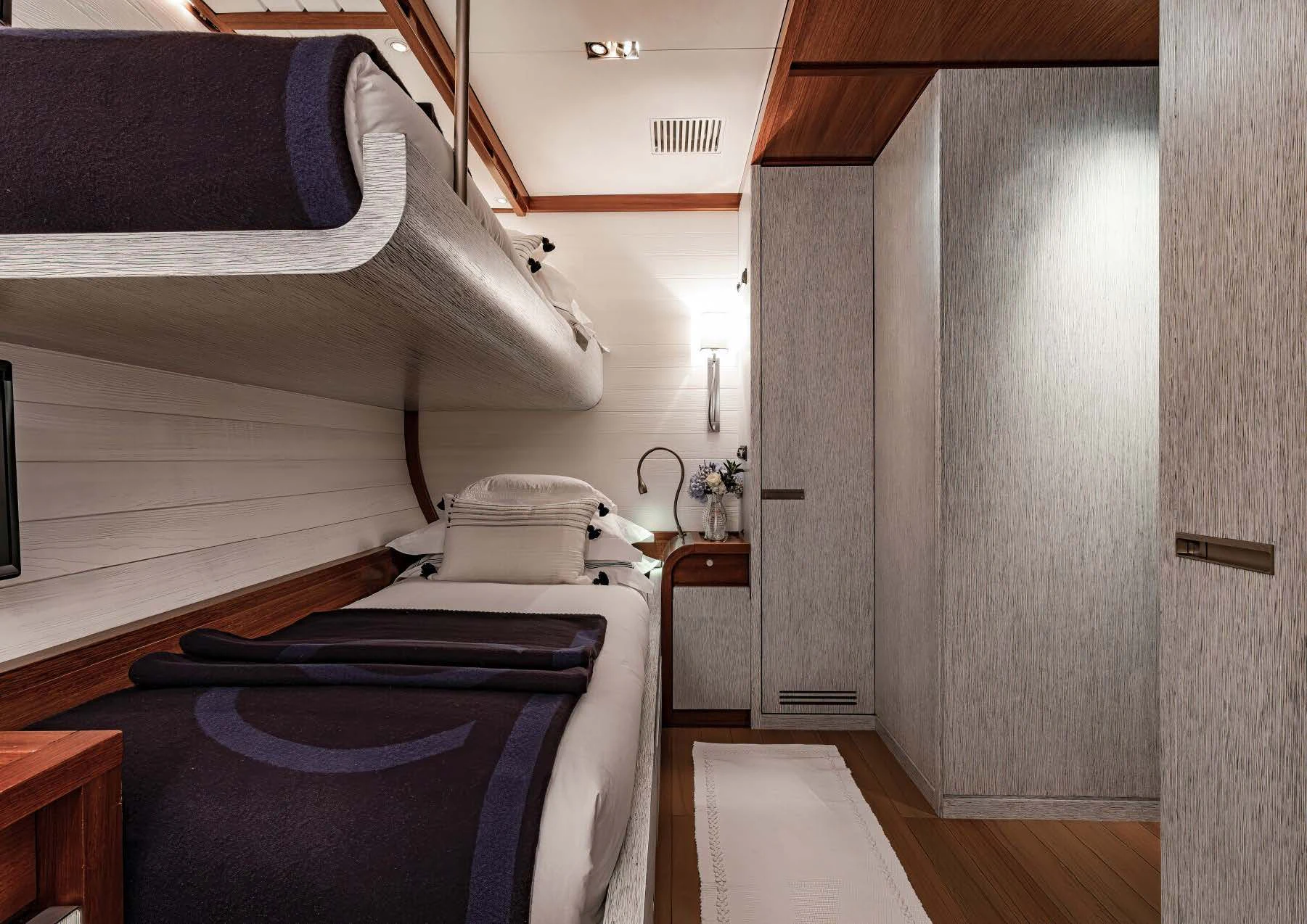 a bed in a room aboard ROSEHEARTY Yacht for Charter