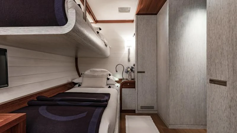 a room with a bed and a desk aboard ROSEHEARTY Yacht for Charter