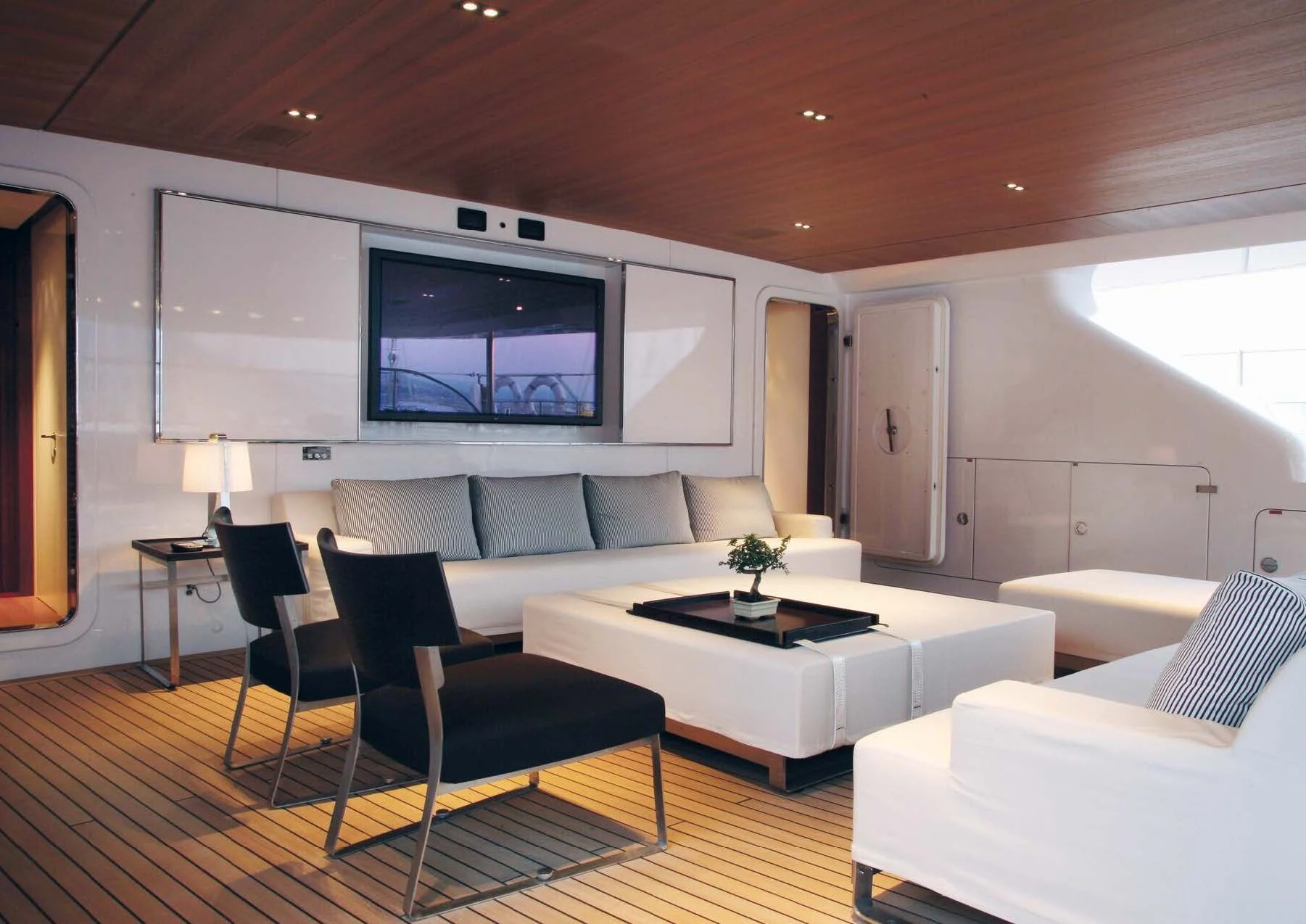 a living room with a large screen aboard ROSEHEARTY Yacht for Charter