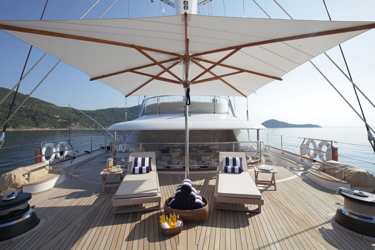 a deck with a large white tent and a table on it aboard ROSEHEARTY Yacht for Charter