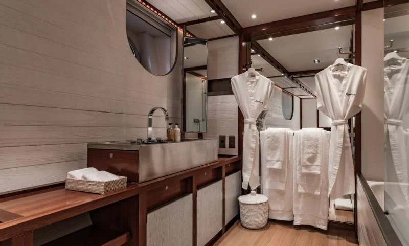 a bathroom with a sink and towels aboard ROSEHEARTY Yacht for Charter