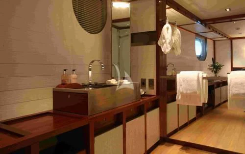 a bathroom with a sink and a mirror aboard ROSEHEARTY Yacht for Charter