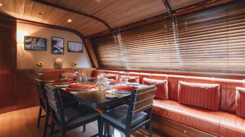 a dining table in a room aboard ROSEHEARTY Yacht for Charter
