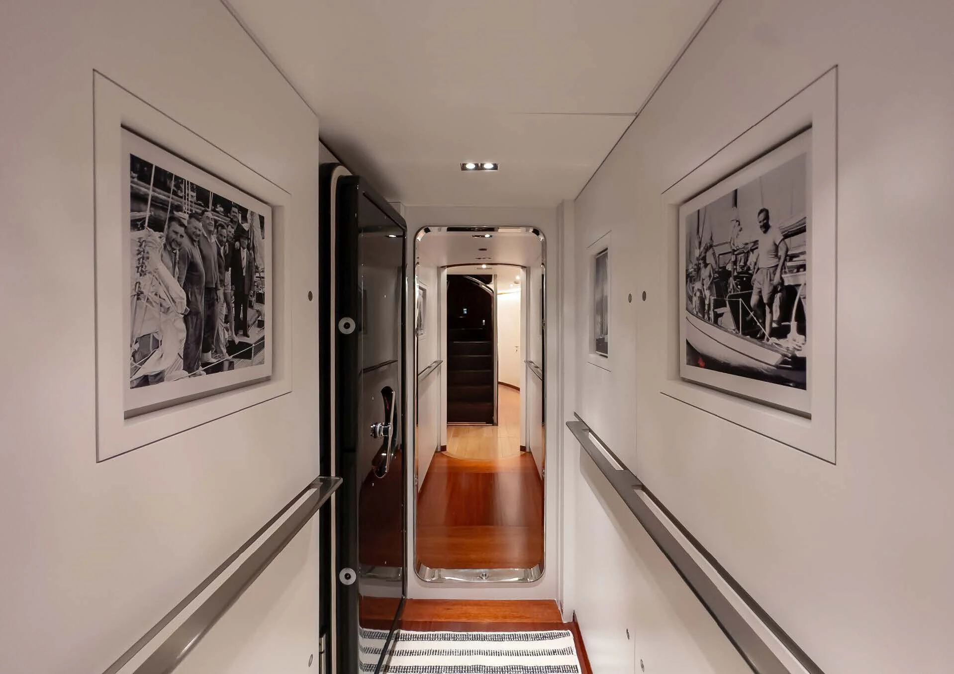 a hallway with paintings on the wall aboard ROSEHEARTY Yacht for Charter