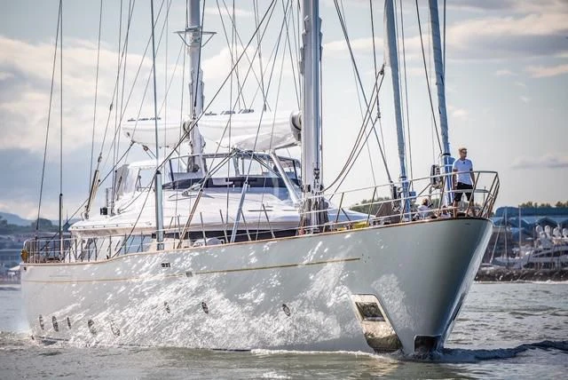 a large white boat with a couple people on it aboard ROSEHEARTY Yacht for Charter