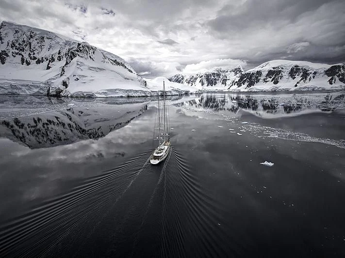 a boat sailing on a lake aboard ROSEHEARTY Yacht for Charter