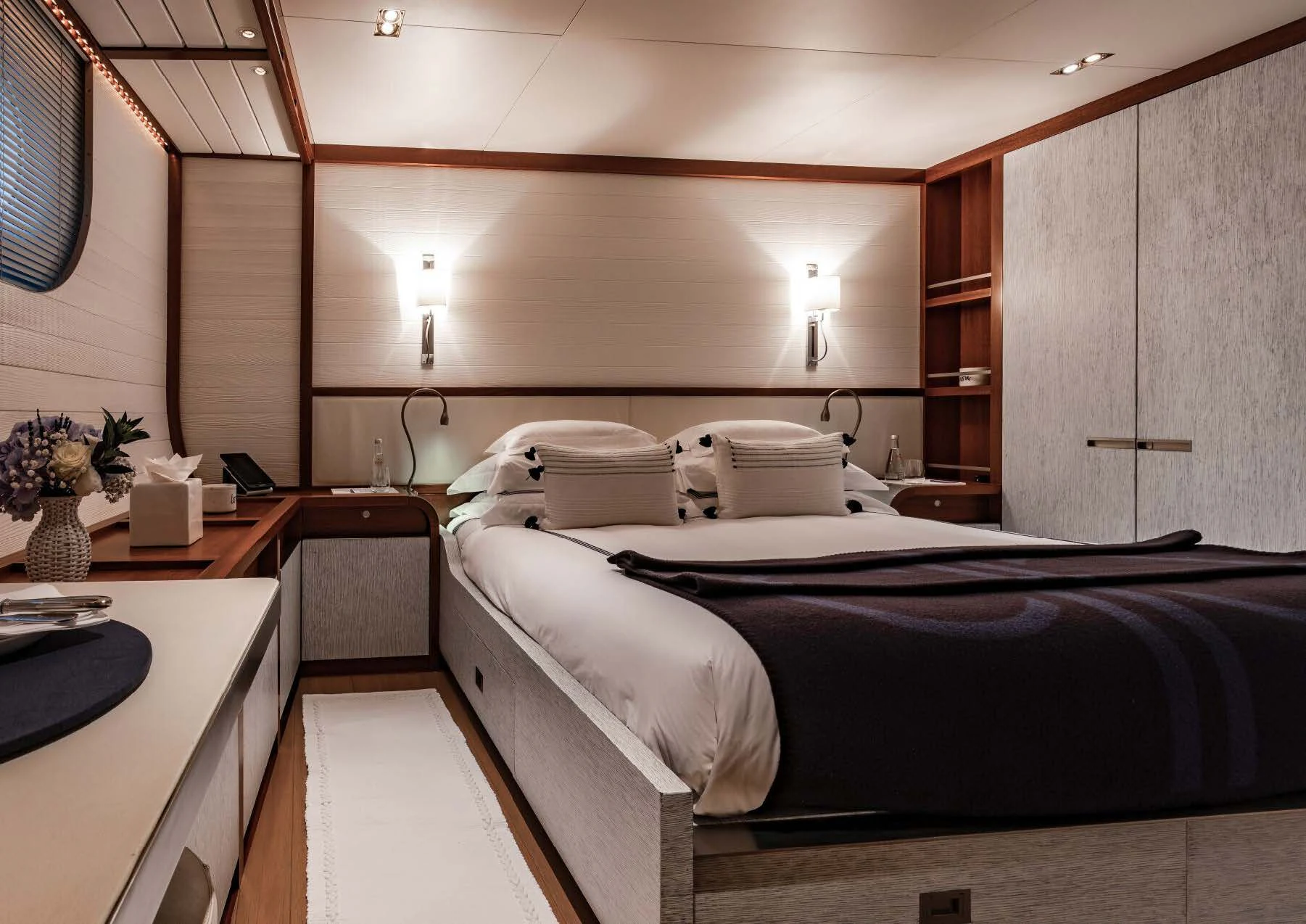 a room with a bed and a desk aboard ROSEHEARTY Yacht for Charter