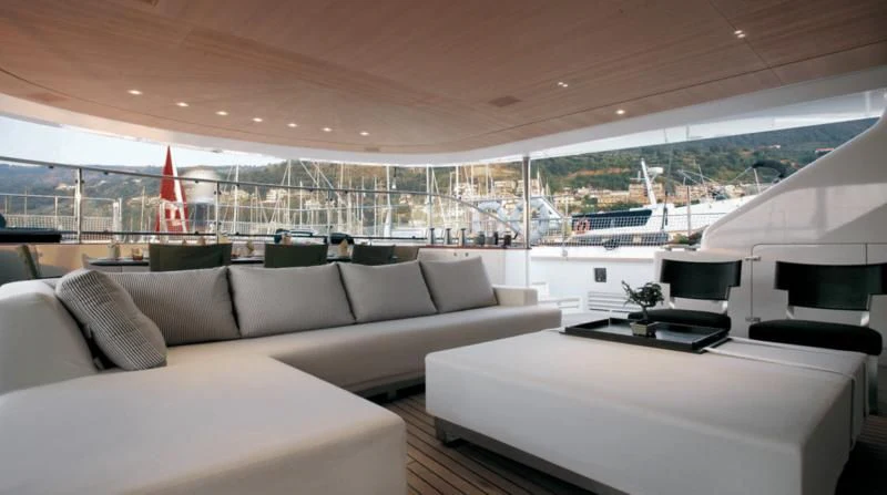 a room with a couch and a table and chairs aboard ROSEHEARTY Yacht for Charter