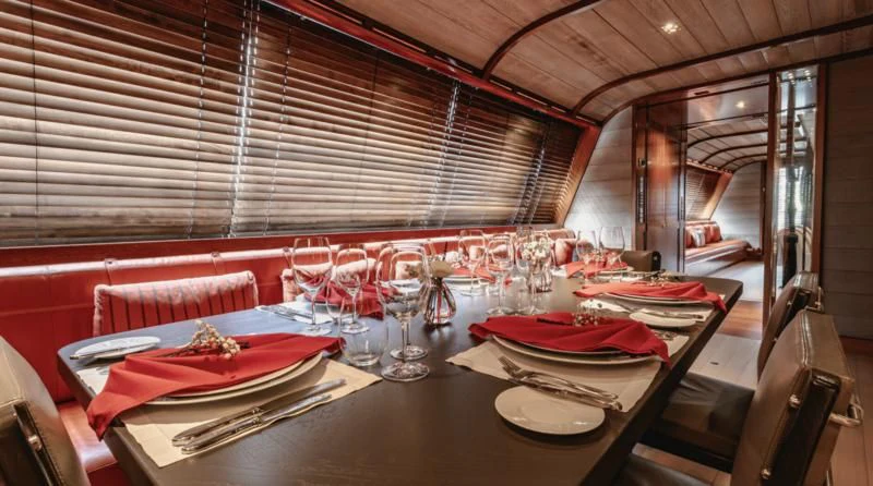 a table set for a dinner aboard ROSEHEARTY Yacht for Charter