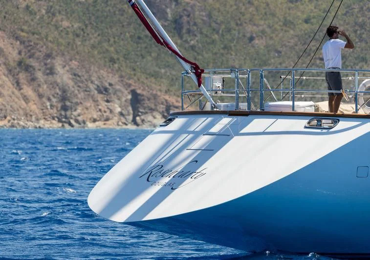 a man standing on a boat aboard ROSEHEARTY Yacht for Charter
