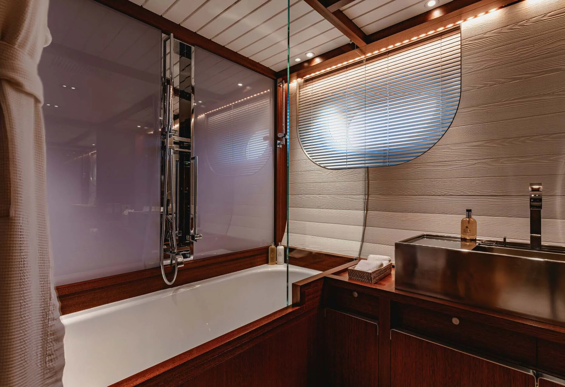a bathroom with a tub sink and a shower unit aboard ROSEHEARTY Yacht for Charter