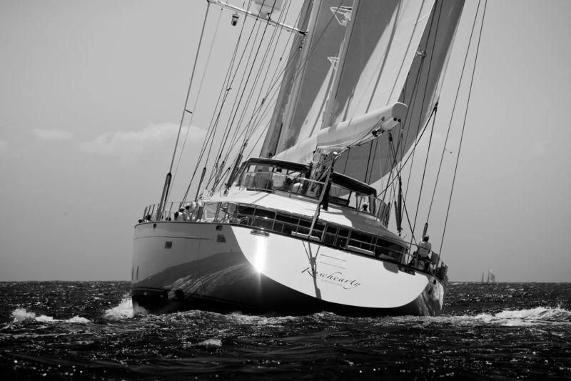 a black and white photo of a sailboat in the water aboard ROSEHEARTY Yacht for Charter