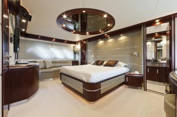 a large bedroom with a large mirror aboard NASEEM Yacht for Sale